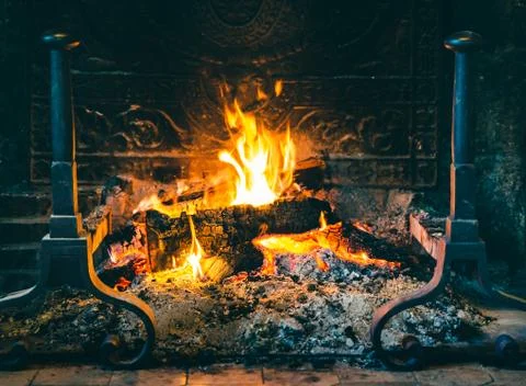 Fire in old chimney Stock Photos