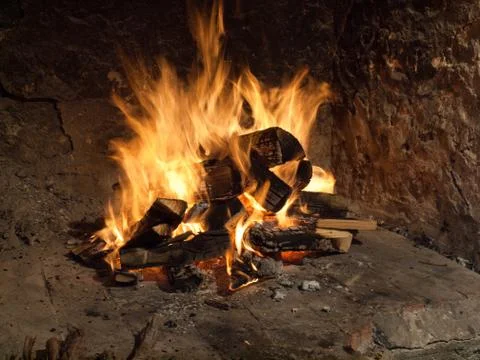 Fire in old firreplace Stock-Fotos