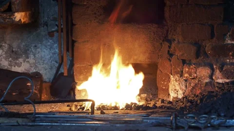 Fire in old forge und fireplace Stock Footage 151652387