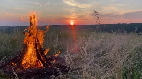 Fire in the open air, at sunset, on the feast of Ivan Kupala Stock Footage 244767878
