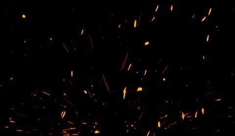 Fire particles effect dust debris isolated on black background, motion powder Stock Illustration