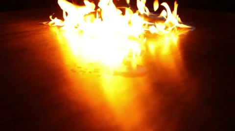 Fire patches in background dancing on reflective surface Stock-Footage 38125031