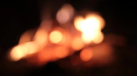A fire at a picnic in the evening, out of focus Stock Footage 52369949