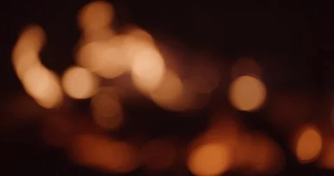 Fire pit and flames out of focus in background Stock Footage 102786827