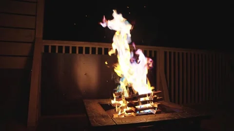 Fire-pit Burning at Campsite in the Night, Slow Motion Pan Stock Footage 340781051