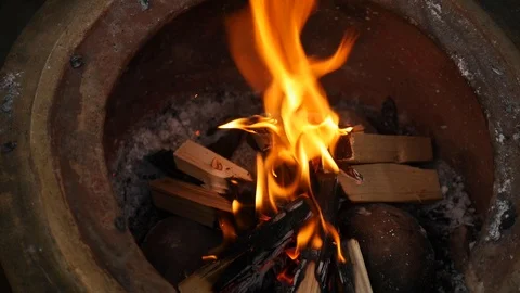 A fire pit burns in slow motion Stock Footage 115055175