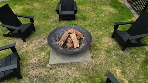 Fire pit chairs back yard country home leisure camping campfire outside deck Stock Footage 278276065