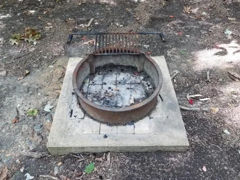 Fire pit or barbecue grill on cement Stock Photos