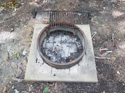 Fire pit or barbecue grill on cement Stock Photos