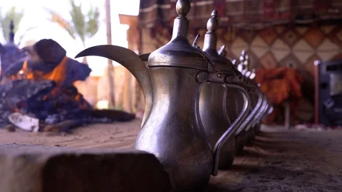 Fire place inside a tent with a lots of Coffee Dallah Stock Footage 110887745