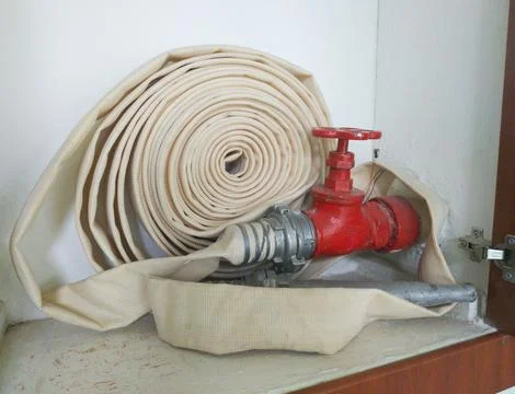 Fire protection cabinet with fire hydrant and hose Stock Photos