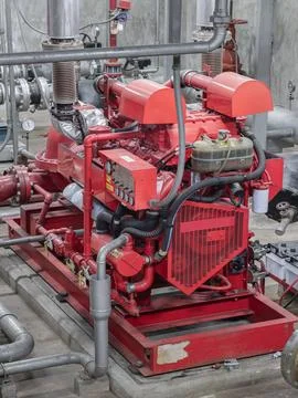 Fire protection system of Condominium. Red generator pump for water sprinkl.. Stock Photos