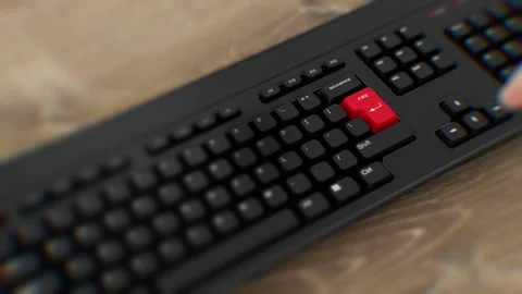 Fire red button on keyboard. A finger presses Fire. Click Fire. Wide Stock Footage 264785195