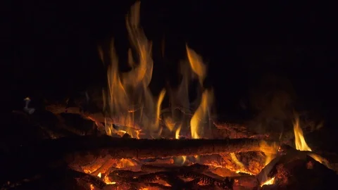 Fire on red-hot coals at night. 4K ultra hd video clip Stock Footage 98143092