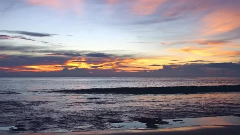 Fire Red Sky Streaked with Shards of Light Through Dark Storm Clouds at Bangkaru Stock Footage 344095011
