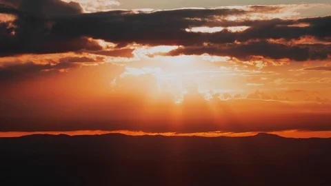 Fire Red Sunrise behind Storm Clouds Wide Time-lapse Stock Footage 127185408