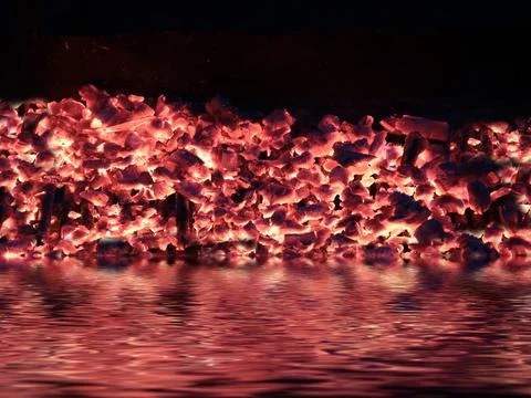 Fire is reflected in the water Stock Photos