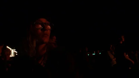 The fire reflects off the crowd watching Stock Footage 122307213