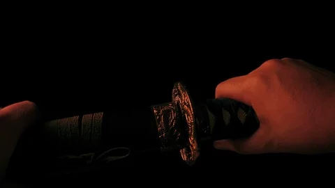 Fire Reflects In Sword Being Unsheashed Stock Footage 97874175