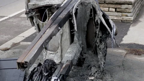 Fire remains melted plastic after arson. Stock Footage 335734479