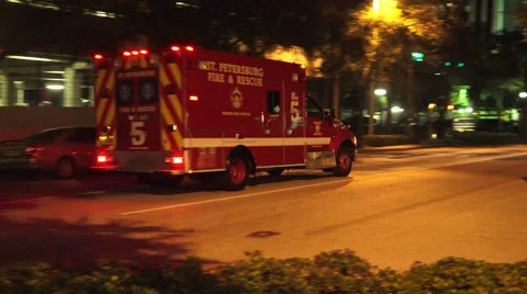 Fire Rescue Ambulance Races Down City Street At Night With Audio 4K Stock Footage