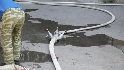 Fire rescue man prepares fire hydrants to extinguish. Russia, Stavropol, 1.05.20 Stock Footage 144778765