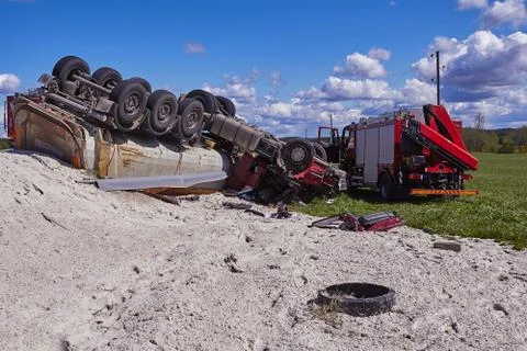 Fire rescue service working on accident place where truck rolled over to the  Stock Photos