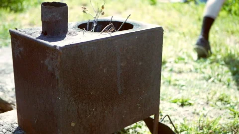 Fire in a rusty outdoor stove. Stock Footage 136194574
