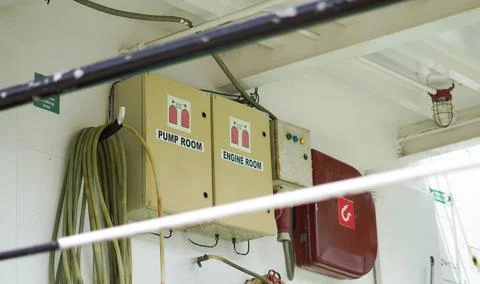 Fire safety control panels for pump and engine rooms on a white ship wall Stock Photos