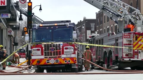 Fire scene at daylight with firefighters Stock Footage 139664310