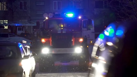 Fire Scene at night with fire trucks and flashing lights on the street Stock Footage 86628830