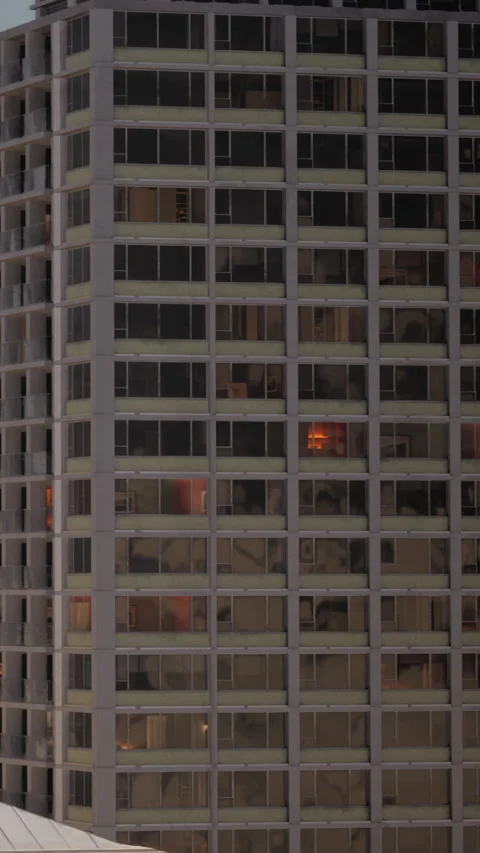 Fire seen through windows of a tall building during nighttime Stock Footage 335100306