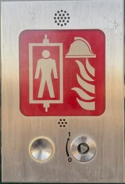 Fire Service Elevator Control Panel with Red Emergency Pictogram and Key Switch Stock Photos