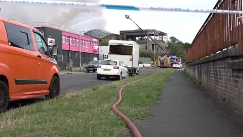 Fire service tackle blaze at Bristol industrial unit Stock Footage 344330059