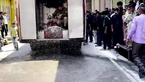 Fire Service Vehicle Spraying Water on Road for Dust Control Видео 339536341