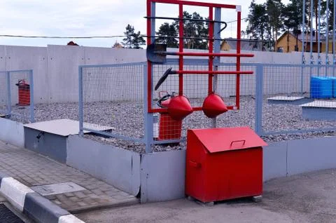 Fire Shield on the wall. Set primary fire extinguishing equipment. Stock Photos