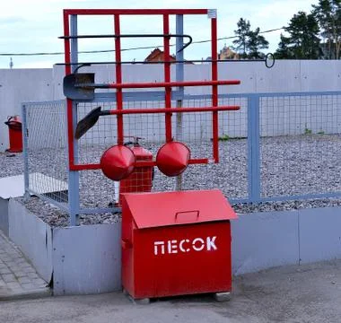 Fire Shield on the wall. Set primary fire extinguishing equipment. Stock Photos