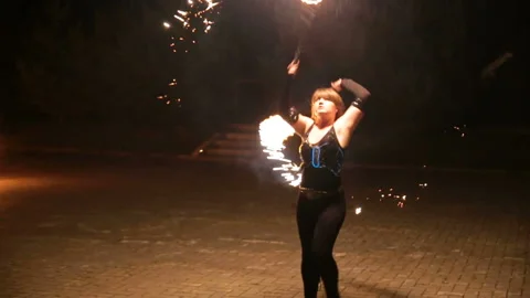 Fire show and a lot of the bright sparks in the night. Stock Footage 87262420