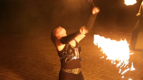 Fire show and a lot of the bright sparks in the night. Stock Footage 87262982