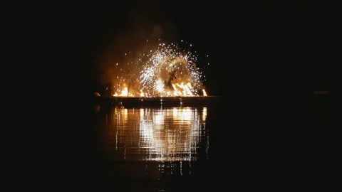 Fire show. artists dance with fire at night on water. Stock Footage 121890582