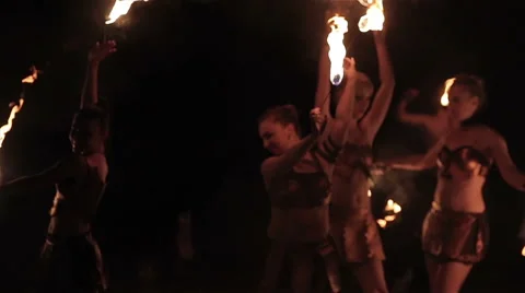 Fire show performance. Female fire performers dance with burning fire torches Stock Footage 62495768