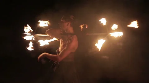 Fire show performance. Handsome male fire performer twirl fire dragon staff Stock Footage 62496080