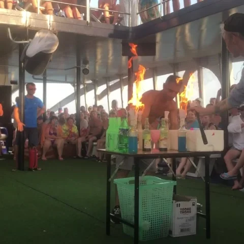 Fire show on the ship trip with barmen, jugglers with alchol Stock Footage 134031355
