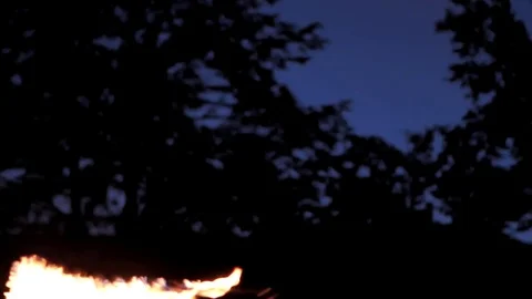 Fire show. Young peoples dances with fire in the night Stock Footage
