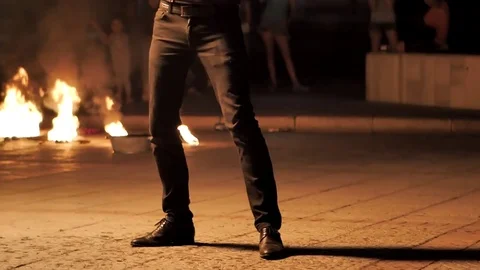 Fire show. Young peoples dances with fire in the night Stock Footage