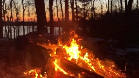 Fire slow motion, evening sky behind Stock Footage 263843370