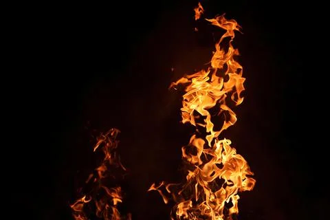 Fire with smoke on the black background Stock Photos