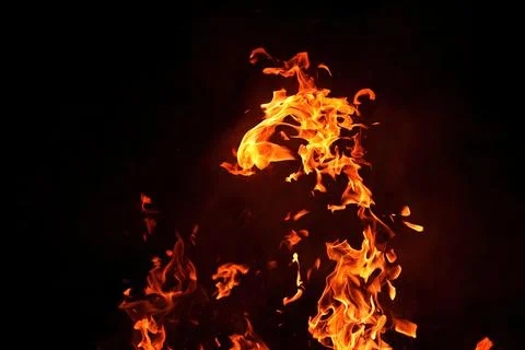 Fire with smoke on the black background Stock Photos