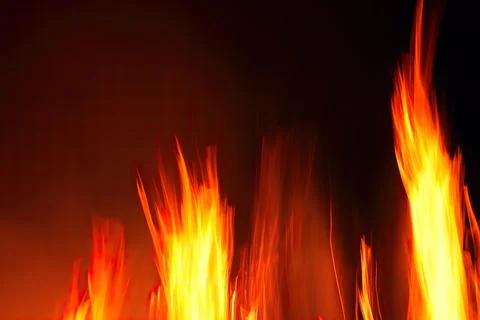 Fire with smoke on the black background Stock Photos