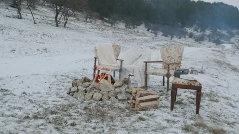 Fire on the snow with the comfortable armchairs and fluffy beds for a lovely Stock Footage 147137652